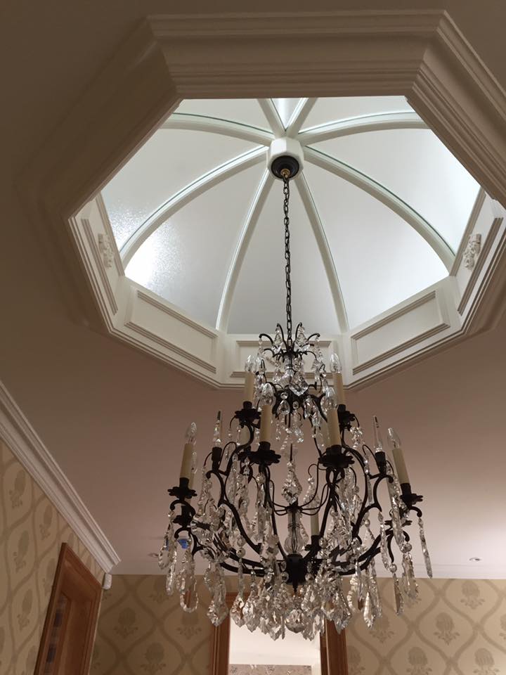 ceiling window and chandelier