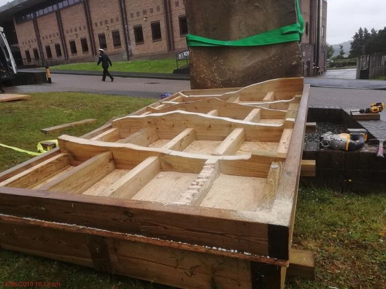 A structural crate to the profile of the Submariners Statue